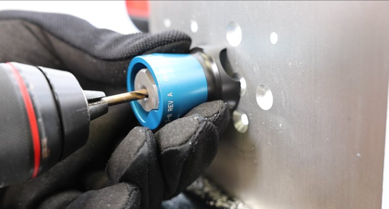 Wescon WES5723 egg cup drill guide with slip fit bushing held square to the part while drilling